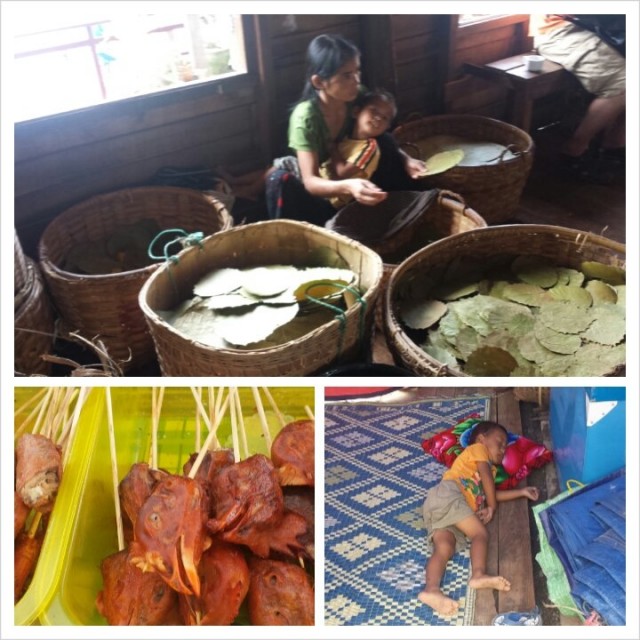 Lapsi nukkuu päiväunia työpaikalla ravintolan lattialla. Toinen istuu tupakanlehtiä lajittelevan naisen sylissä.